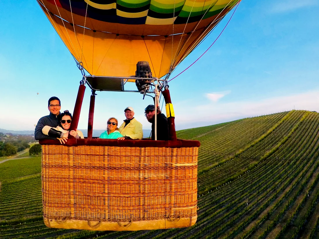 Guests in the basket over Sonoma vineyards on a join-in flight