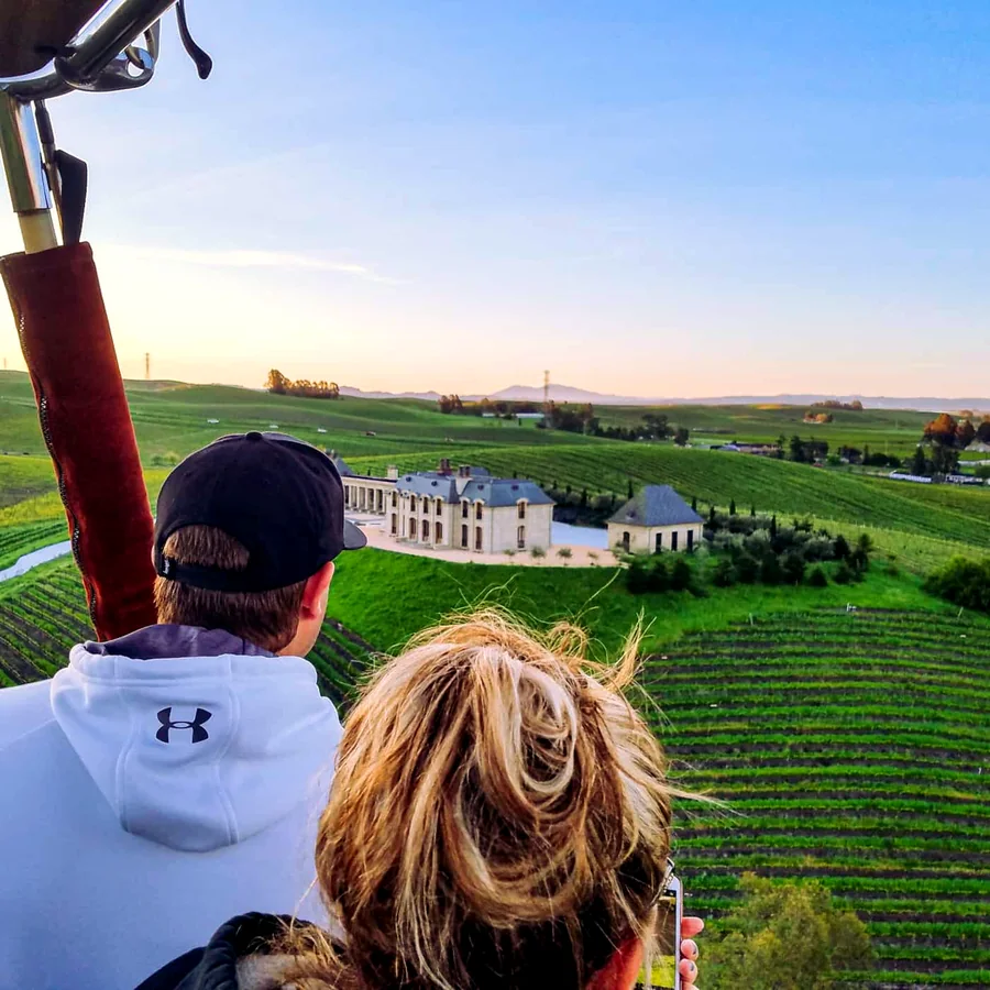 Guest looking out over the vineyards from the basket